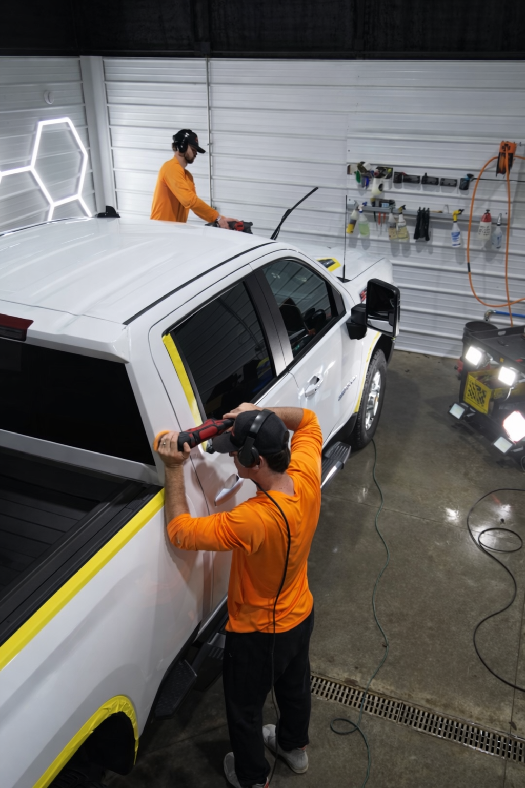 Paint correction in progress on a white truck in Joplin, MO